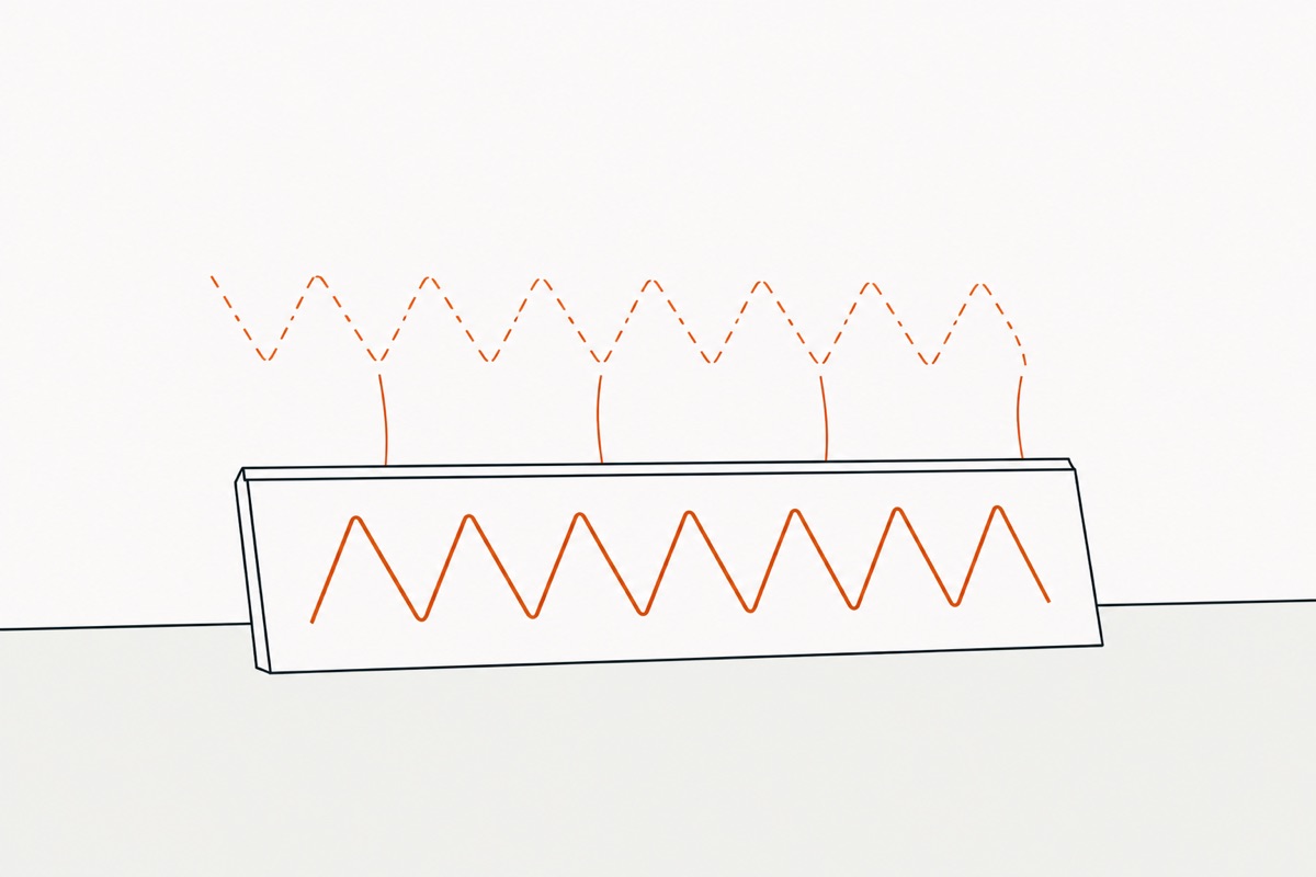 The trim pulled back off the wall, a matching zigzag print left on the wall and fine strands stretching between the two