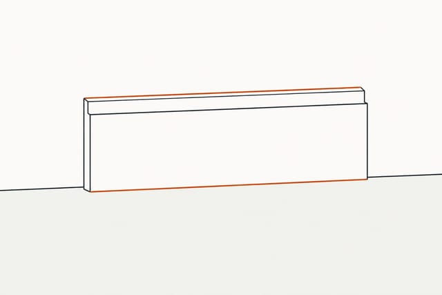 A length of trim standing against the bare wall with nothing holding it, the lines where it meets wall and floor picked out